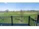 Picturesque view from the balcony overlooking a spacious backyard with a serene and green landscape at 7282 Zanesville Rd, Carmel, IN 46033