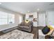 Cozy living room with white bar and wood floors at 7282 Zanesville Rd, Carmel, IN 46033