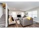Inviting living room with natural lighting, stylish furniture, and wood floors at 7282 Zanesville Rd, Carmel, IN 46033