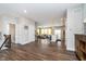 Spacious living area with hardwood floors, staircase, and open access to the kitchen at 7282 Zanesville Rd, Carmel, IN 46033
