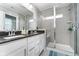 Elegant main bathroom featuring double sinks, granite counters, and a glass-enclosed shower at 7282 Zanesville Rd, Carmel, IN 46033