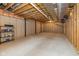 Unfinished basement with exposed ceiling, concrete flooring, and metal supports at 7290 Lockford Walk N, Avon, IN 46123
