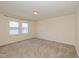 This cozy bedroom features plush carpeting and natural light from the bright window at 7290 Lockford Walk N, Avon, IN 46123