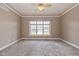 Serene bedroom with plush carpeting, a ceiling fan, and a large window with natural light at 7290 Lockford Walk N, Avon, IN 46123