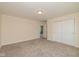 This cozy bedroom features plush carpeting and a closet for storage at 7290 Lockford Walk N, Avon, IN 46123