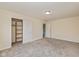 Bedroom featuring plush carpet, sliding door closet and a light fixture at 7290 Lockford Walk N, Avon, IN 46123