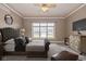 Luxurious main bedroom with a tufted headboard, soft lighting, and a serene atmosphere at 7290 Lockford Walk N, Avon, IN 46123