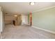 Bonus room featuring plush carpet and a wrought iron staircase at 7290 Lockford Walk N, Avon, IN 46123
