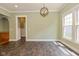 Elegant dining area with modern lighting, views to the kitchen, and natural light at 7290 Lockford Walk N, Avon, IN 46123