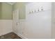 A welcoming entryway with white wainscoting, coat hooks and door at 7290 Lockford Walk N, Avon, IN 46123