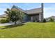 Beautiful home exterior featuring a well-maintained lawn and a mature tree at 7290 Lockford Walk N, Avon, IN 46123