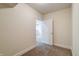 The hallway leads to a carpeted bedroom, featuring fresh neutral paint at 7290 Lockford Walk N, Avon, IN 46123