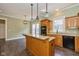 Cozy kitchen with an island, granite countertops, and stylish pendant lighting at 7290 Lockford Walk N, Avon, IN 46123