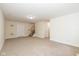 Spacious living room with plush carpeting and stairs at 7290 Lockford Walk N, Avon, IN 46123