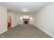 Spacious living room with a cozy brick fireplace and natural light at 7290 Lockford Walk N, Avon, IN 46123