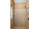 Tiled shower with glass block window and dual shower heads at 7290 Lockford Walk N, Avon, IN 46123