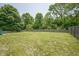 A large, well-maintained backyard with a wood fence, offering a private outdoor space at 8391 Inland Dr, Avon, IN 46123