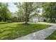 Charming single-story home with well-manicured lawn, brick accents, and attached two-car garage at 8391 Inland Dr, Avon, IN 46123