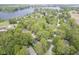 Aerial view of tree-lined neighborhood and lake providing a picturesque backdrop at 1127 Grant Cir, Cicero, IN 46034