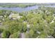 Neighborhood aerial view showcasing the lake in the distance with mature trees at 1127 Grant Cir, Cicero, IN 46034