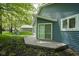 Rear of the home featuring a small deck and well-maintained yard; great for relaxing and entertaining at 1127 Grant Cir, Cicero, IN 46034