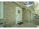 Charming front door with stone surround, wreath, and house number, inviting you to make this house your home at 1127 Grant Cir, Cicero, IN 46034