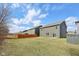 A well-manicured backyard with wood fencing and ample lawn space, perfect for outdoor activities at 8131 Trailstay Dr, Camby, IN 46113