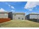A lovely fenced backyard with a large lawn and view of neighboring homes on a sunny day at 8131 Trailstay Dr, Camby, IN 46113