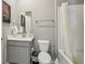 Bright bathroom featuring a shower with a white curtain and white tile, plus stylish vanity at 8131 Trailstay Dr, Camby, IN 46113