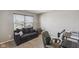 Bedroom featuring a comfortable dark grey sofa and desk at 8131 Trailstay Dr, Camby, IN 46113