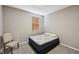 Bedroom with a bed, window, and chair on the carpet at 8131 Trailstay Dr, Camby, IN 46113