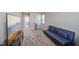 Upstairs bonus room with a blue sofa and television at 8131 Trailstay Dr, Camby, IN 46113