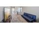 Upstairs bonus room with a blue sofa and television at 8131 Trailstay Dr, Camby, IN 46113