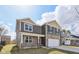 Charming two-story home with gray siding, stone accents, and an attached two-car garage at 8131 Trailstay Dr, Camby, IN 46113