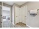 Hallway featuring a view into the bedroom and set of linen closets at 8131 Trailstay Dr, Camby, IN 46113