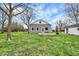 A charming home with a spacious backyard and mature trees at 8240 Shelbyville Rd, Indianapolis, IN 46259