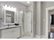 Bathroom featuring a tiled floor, stand-up shower, and vanity at 8240 Shelbyville Rd, Indianapolis, IN 46259