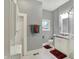 Bathroom featuring a tiled floor, shower, vanity, and washer/dryer at 8240 Shelbyville Rd, Indianapolis, IN 46259