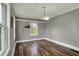 Bright bedroom with hardwood floors, neutral walls, and natural light at 8240 Shelbyville Rd, Indianapolis, IN 46259