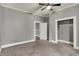 This bedroom offers neutral decor and carpeted flooring at 8240 Shelbyville Rd, Indianapolis, IN 46259