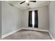 Bedroom featuring neutral paint, carpeting, and a ceiling fan at 8240 Shelbyville Rd, Indianapolis, IN 46259