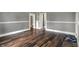 Bright and airy living room featuring hardwood floors and fresh paint at 8240 Shelbyville Rd, Indianapolis, IN 46259