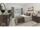 Spacious bedroom with large windows and stylish furnishings at 907 S East St, Indianapolis, IN 46225