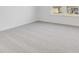 Sunlit, carpeted bedroom features neutral colors and a double window at 908 Stonehaven Dr, Indianapolis, IN 46239