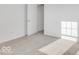 This bedroom features neutral walls, light carpet, and a door to an ensuite at 908 Stonehaven Dr, Indianapolis, IN 46239