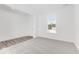Bright bedroom featuring neutral carpet, white walls and natural light from the large window at 908 Stonehaven Dr, Indianapolis, IN 46239