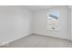 This bedroom features light carpet, a window and neutral walls at 908 Stonehaven Dr, Indianapolis, IN 46239