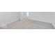 This bedroom features light carpet, white walls, and a door to an ensuite at 908 Stonehaven Dr, Indianapolis, IN 46239