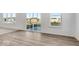 Bright living room showcasing beautiful floors, large sliding glass doors and neighborhood views at 908 Stonehaven Dr, Indianapolis, IN 46239