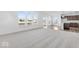 Living room leading to the kitchen and dinette area that has large windows overlooking the backyard at 908 Stonehaven Dr, Indianapolis, IN 46239